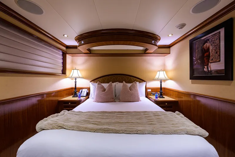 Excellence Yacht Photos Pics Luxurious bedroom interior on 2010 Richmond Yachts 150, featuring elegant lighting and decor.