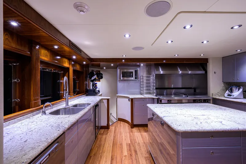 Excellence Yacht Photos Pics Luxurious yacht kitchen with modern appliances, granite countertops, and wood flooring, Richmond Yachts 150, 2010.
