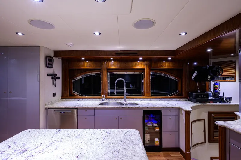 Excellence Yacht Photos Pics Luxurious yacht kitchen with marble countertops, modern appliances, and elegant wood accents, Richmond Yachts 150, 2010.
