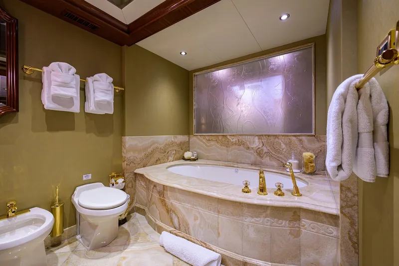 Excellence Yacht Photos Pics Luxurious yacht bathroom with marble tub, gold fixtures, and elegant decor, Richmond Yachts 150, 2010.