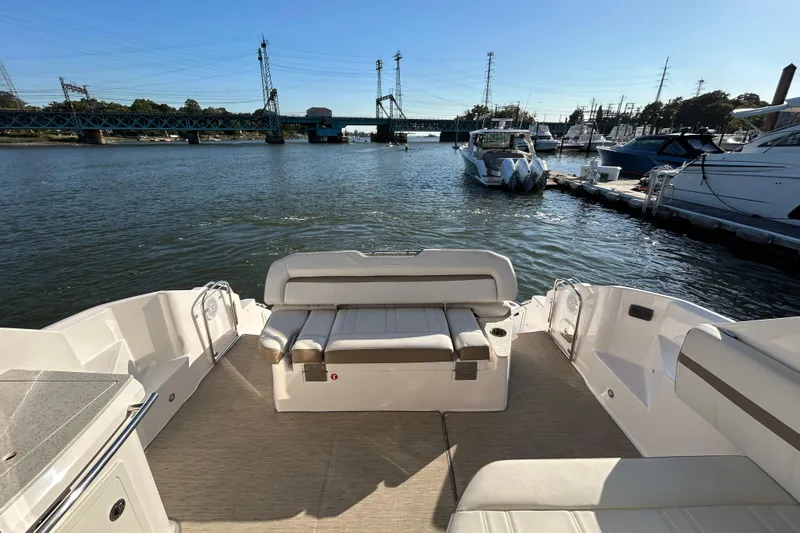  Yacht Photos Pics 2018 Regal 42 Sport Coupe yacht interior with waterfront view and docked boats.