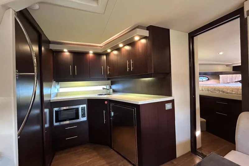  Yacht Photos Pics Luxurious interior of 2018 Regal 42 Sport Coupe yacht with modern kitchen amenities.