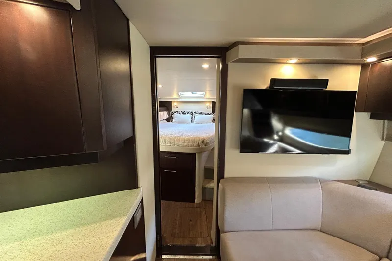  Yacht Photos Pics 2018 Regal 42 Sport Coupe interior with modern design, featuring a cozy bedroom and sleek living area.