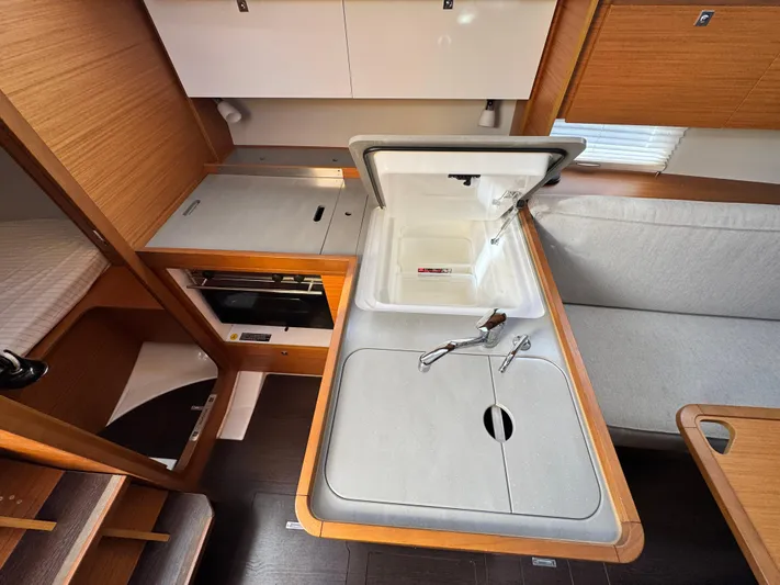 Yacht Photos Pics Modern kitchen area in 2021 Dufour 360 sailboat with sink and storage.