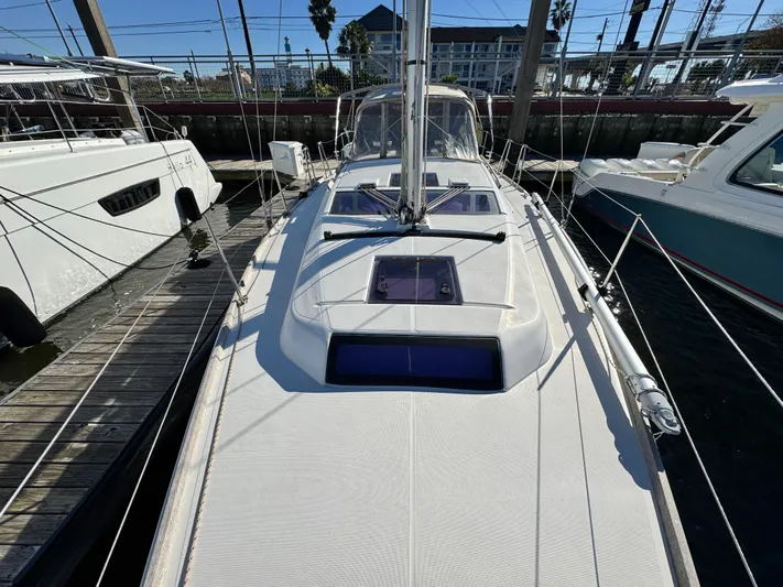  Yacht Photos Pics 2021 Dufour 360 sailboat docked at marina, showcasing sleek deck design.