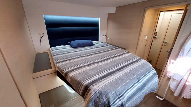  Yacht Photos Pics Luxurious bedroom interior of 2018 Fountaine Pajot Saona 47 catamaran with modern design.