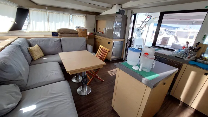  Yacht Photos Pics Spacious interior of 2018 Fountaine Pajot Saona 47 catamaran with modern kitchen and seating area.