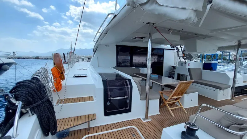  Yacht Photos Pics 2018 Fountaine Pajot Saona 47 catamaran with spacious deck and seating area.