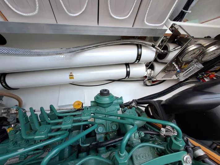  Yacht Photos Pics Engine room of 2018 Fountaine Pajot Saona 47 catamaran, showcasing mechanical components and piping.