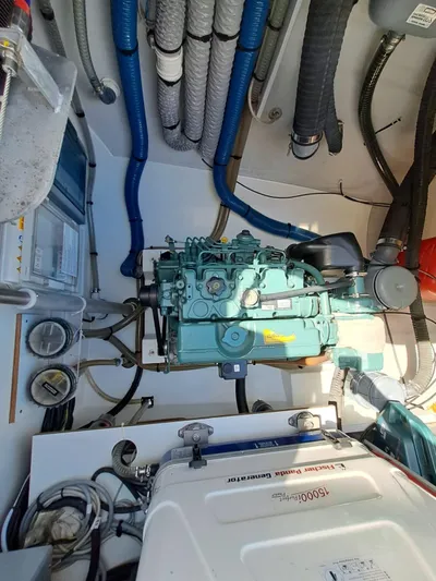  Yacht Photos Pics Engine room of 2018 Fountaine Pajot Saona 47 catamaran, showcasing mechanical components and wiring.