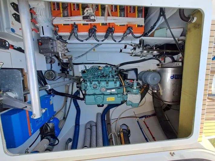  Yacht Photos Pics Engine room of 2018 Fountaine Pajot Saona 47 catamaran, showcasing mechanical components and wiring.