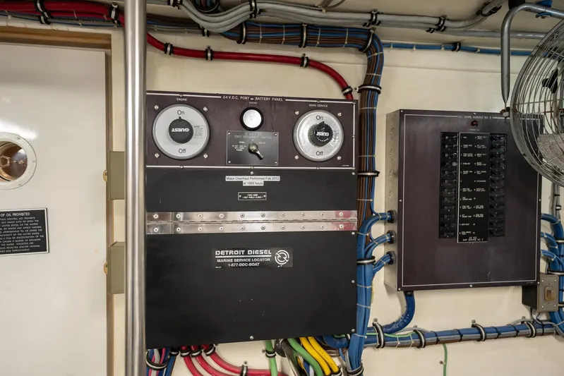 Hatt's Off Yacht Photos Pics Electrical panel and wiring inside a 1998 Hatteras 74 Cockpit Motor Yacht engine room.