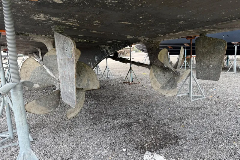 Hatt's Off Yacht Photos Pics Propellers and rudders of a 1998 Hatteras 74 Cockpit Motor Yacht on dry dock.