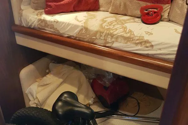  Yacht Photos Pics Interior of a 2008 Sunseeker Predator 72 yacht with a cluttered cabin space.