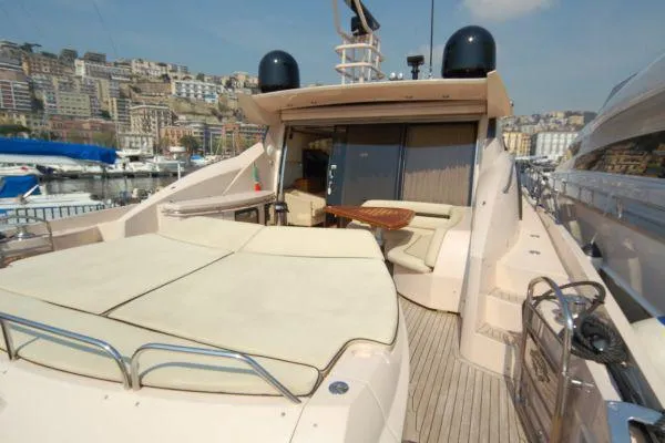  Yacht Photos Pics 2008 Sunseeker Predator 72 yacht with spacious deck and luxurious seating in marina.