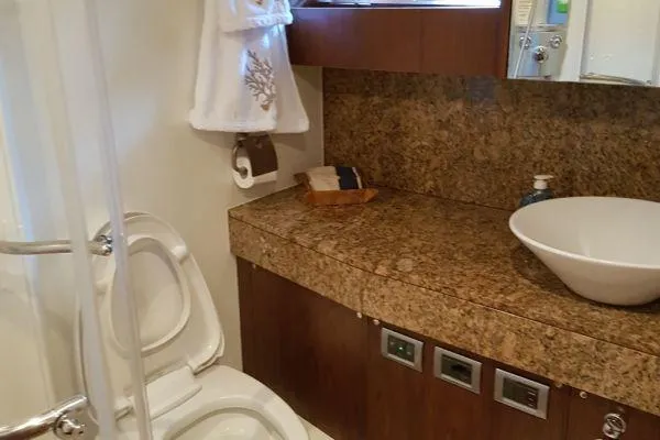  Yacht Photos Pics Luxurious bathroom in 2008 Sunseeker Predator 72 yacht with granite countertop and modern fixtures.