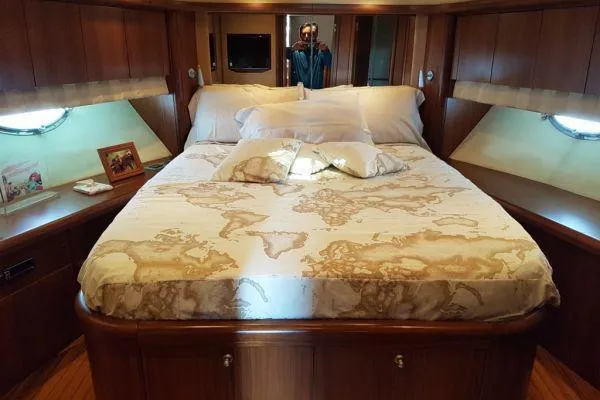  Yacht Photos Pics Luxurious bedroom interior of 2008 Sunseeker Predator 72 yacht with map-themed bedding.