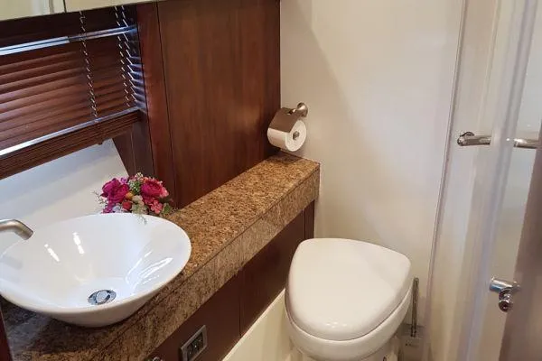  Yacht Photos Pics Luxurious bathroom in 2008 Sunseeker Predator 72 yacht with modern sink and toilet.