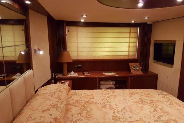  Yacht Photos Pics Luxurious bedroom interior of 2008 Sunseeker Predator 72 yacht with elegant decor and ambient lighting.