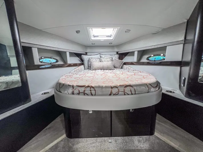 Liquid Asset Yacht Photos Pics Luxurious cabin interior of a 2017 Formula 40 PC yacht with a cozy bed.