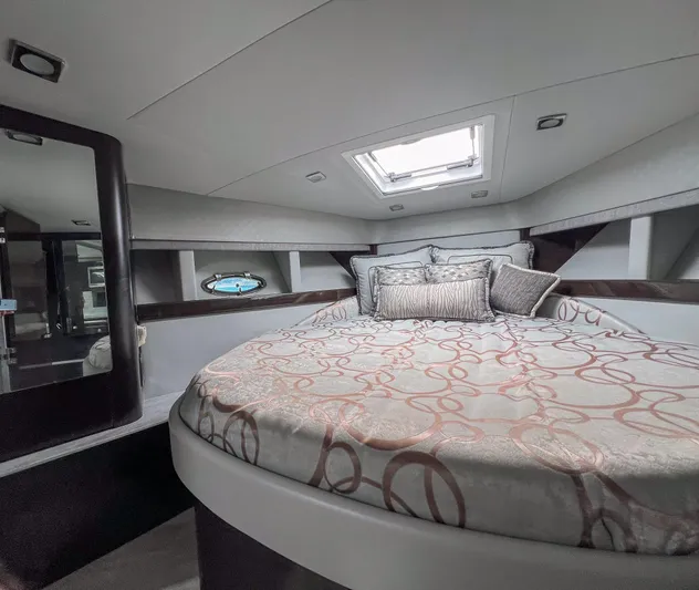 Liquid Asset Yacht Photos Pics Luxurious bedroom interior of a 2017 Formula 40 PC yacht with skylight.