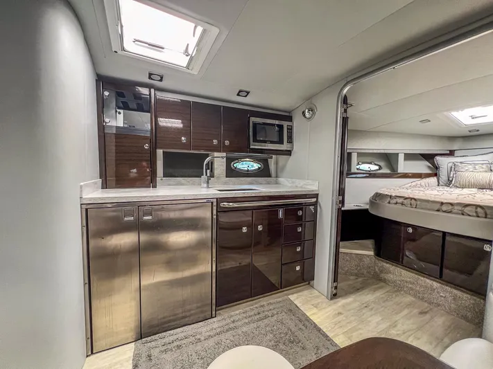 Liquid Asset Yacht Photos Pics Modern kitchen and bedroom interior of a 2017 Formula 40 PC yacht.