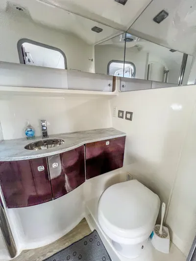 Liquid Asset Yacht Photos Pics Modern bathroom in a 2017 Formula 40 PC yacht with sink and toilet.