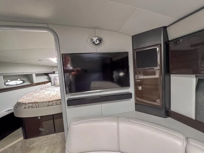 Liquid Asset Yacht Photos Pics Interior of 2017 Formula 40 PC yacht with TV, seating, and bedroom.