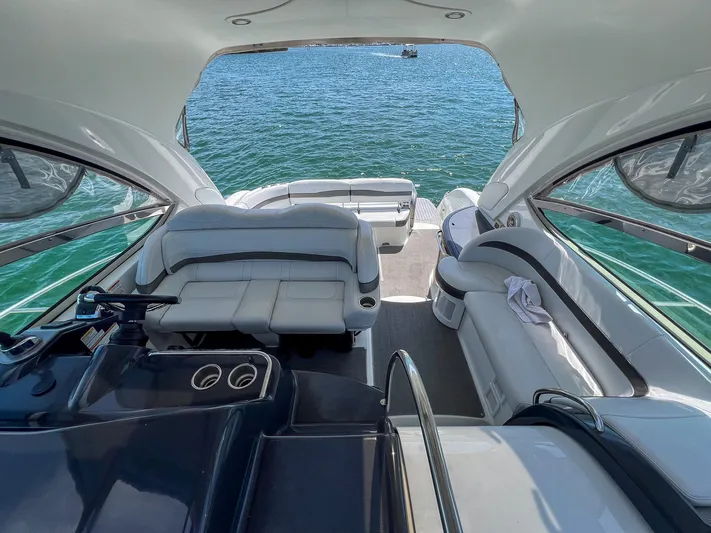 Liquid Asset Yacht Photos Pics Interior of a 2017 Formula 40 PC yacht with luxurious seating and ocean view.