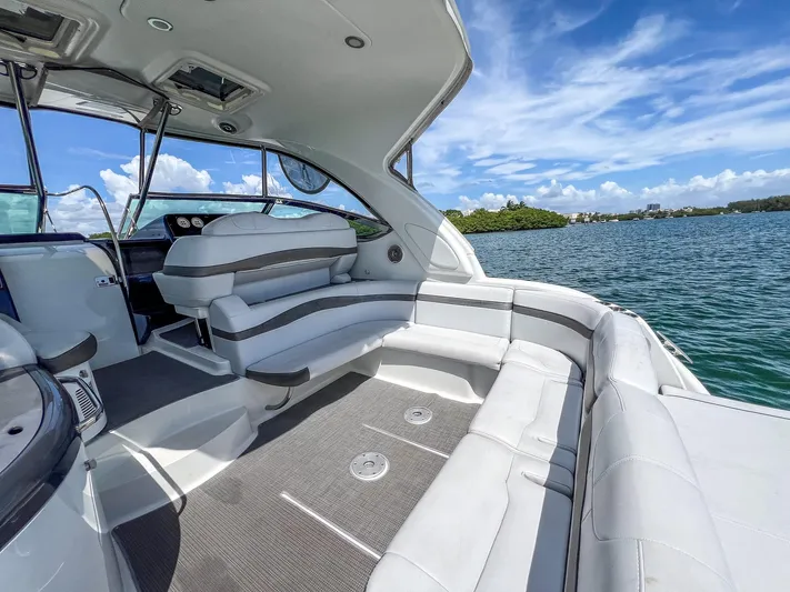 Liquid Asset Yacht Photos Pics 2017 Formula 40 PC yacht interior with luxurious seating, on a sunny day by the water.