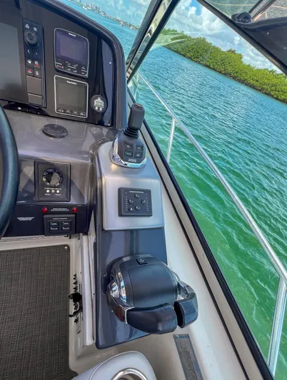 Liquid Asset Yacht Photos Pics Control panel of a 2017 Formula 40 PC yacht with scenic water view.