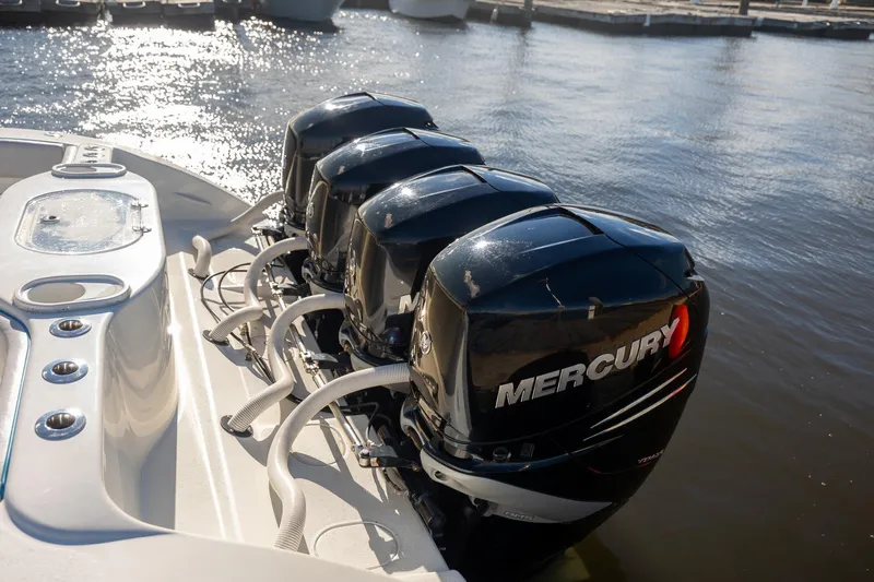  Yacht Photos Pics 2018 Yellowfin 39 Offshore boat with four Mercury outboard engines docked by the water.