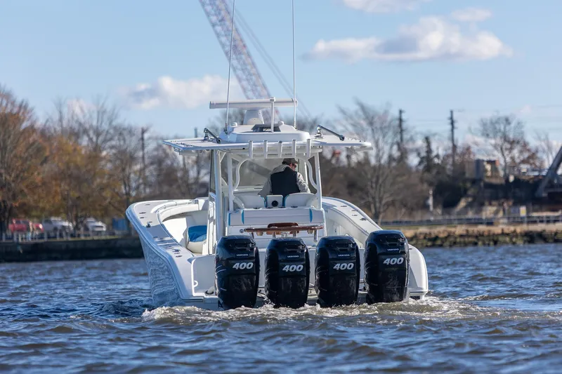  Yacht Photos Pics 2018 Yellowfin 39 Offshore boat with four powerful engines cruising on water.