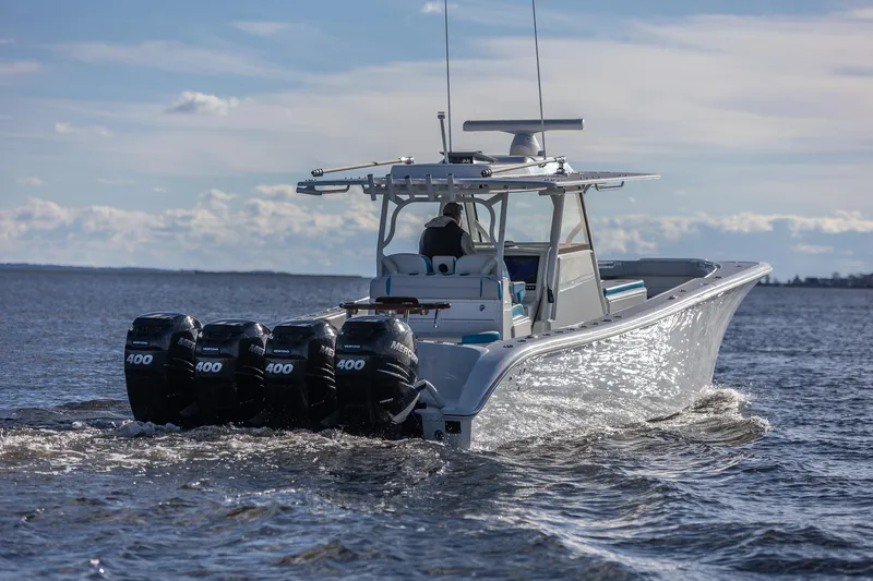  Yacht Photos Pics 2018 Yellowfin 39 Offshore boat with four powerful outboard engines cruising on open water.