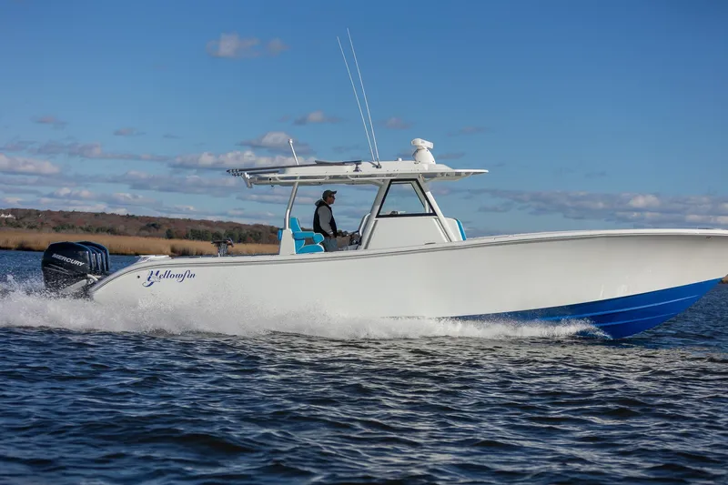  Yacht Photos Pics 2018 Yellowfin 39 Offshore boat cruising on open water under clear blue sky.