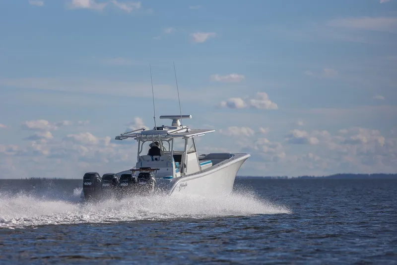  Yacht Photos Pics 2018 Yellowfin 39 Offshore boat cruising on open water under a clear sky.