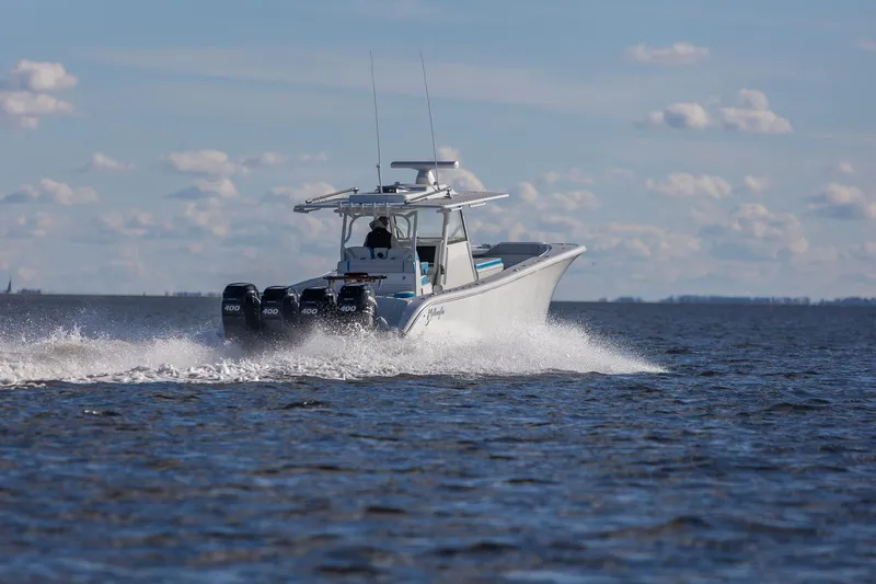  Yacht Photos Pics 2018 Yellowfin 39 Offshore boat cruising on open water under a clear sky.