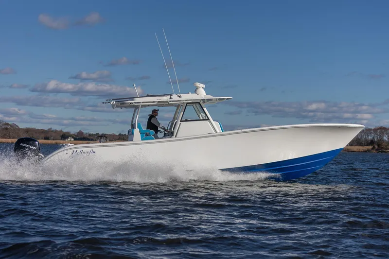  Yacht Photos Pics 2018 Yellowfin 39 Offshore boat cruising on open water under a clear blue sky.