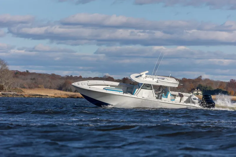  Yacht Photos Pics 2018 Yellowfin 39 Offshore boat cruising on a scenic waterway.