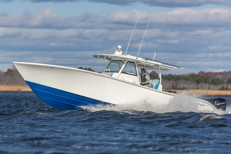  Yacht Photos Pics 2018 Yellowfin 39 Offshore boat cruising on open water under a cloudy sky.