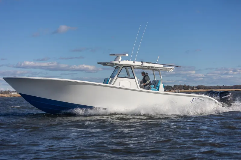  Yacht Photos Pics 2018 Yellowfin 39 Offshore boat cruising on open water under clear blue sky.