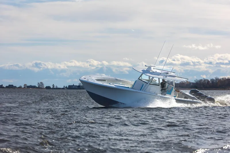  Yacht Photos Pics 2018 Yellowfin 39 Offshore boat cruising on open water under cloudy sky.