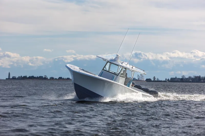  Yacht Photos Pics 2018 Yellowfin 39 Offshore boat cruising on open water under a cloudy sky.