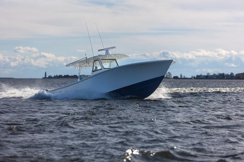  Yacht Photos Pics 2018 Yellowfin 39 Offshore boat cruising on open water under a clear sky.