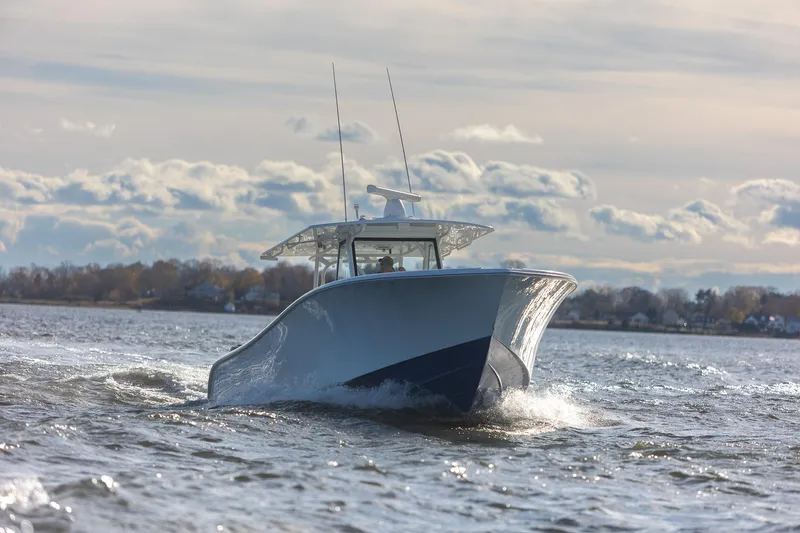  Yacht Photos Pics 2018 Yellowfin 39 Offshore boat cruising on open water under cloudy sky.