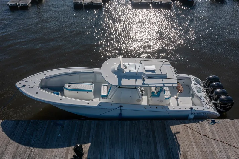  Yacht Photos Pics 2018 Yellowfin 39 Offshore boat docked, featuring sleek design and powerful engines.
