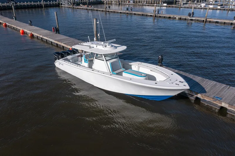  Yacht Photos Pics 2018 Yellowfin 39 Offshore boat docked at marina, side view.