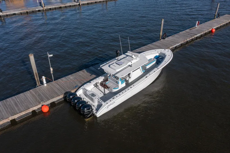  Yacht Photos Pics 2018 Yellowfin 39 Offshore boat docked on calm water.