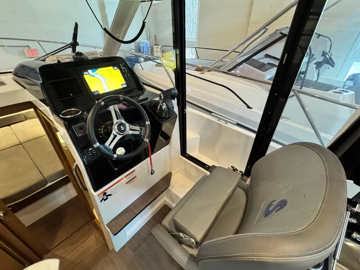  Yacht Photos Pics 2022 Beneteau Antares 9 helm with navigation display and comfortable seating.