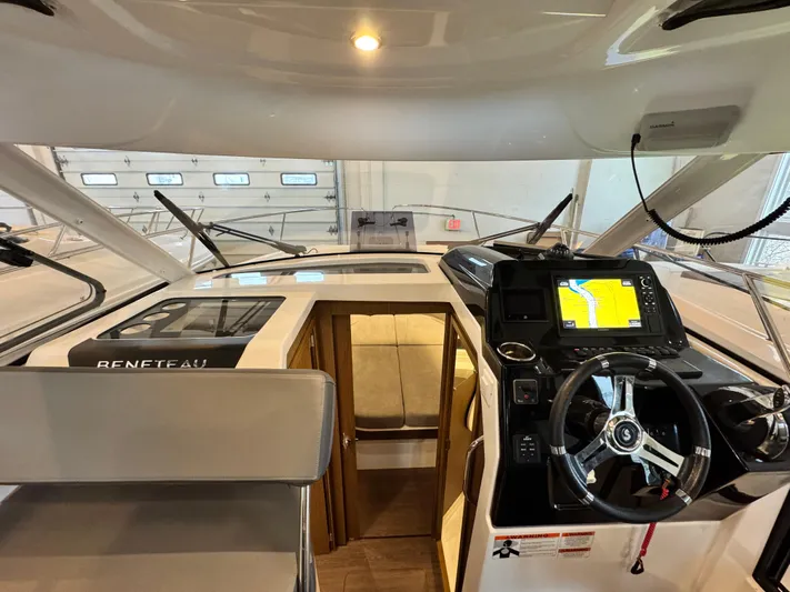  Yacht Photos Pics Interior view of 2022 Beneteau Antares 9 boat cockpit with navigation system.